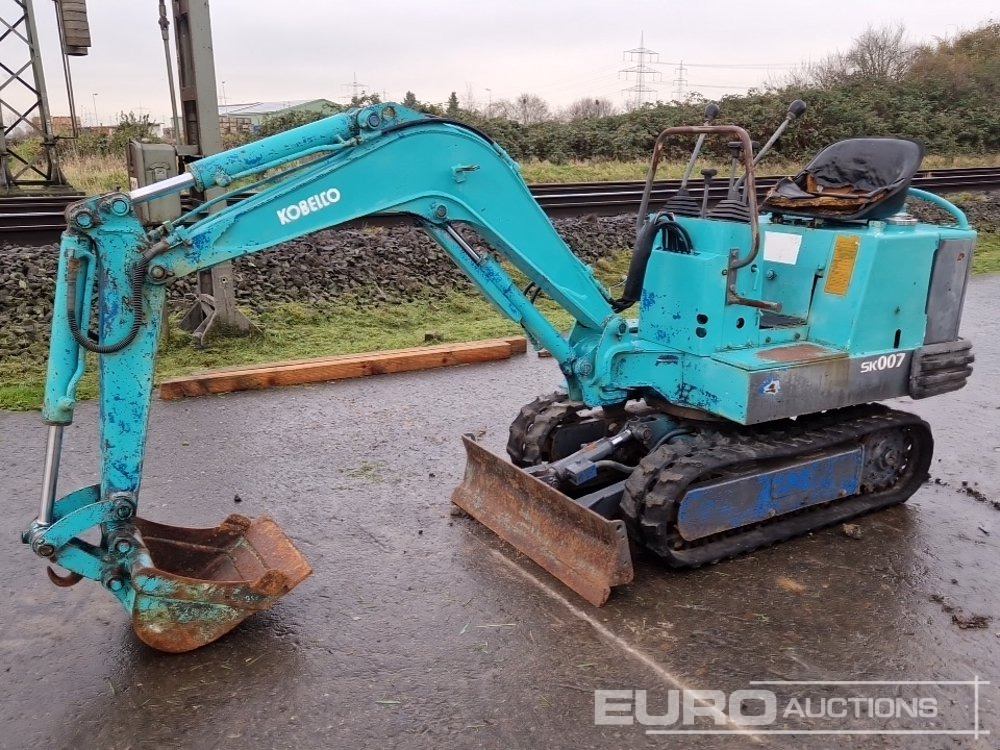 Kobelco SK007 - حفارة مصغرة: صور 1 Kobelco SK007 - حفارة مصغرة: صور 1