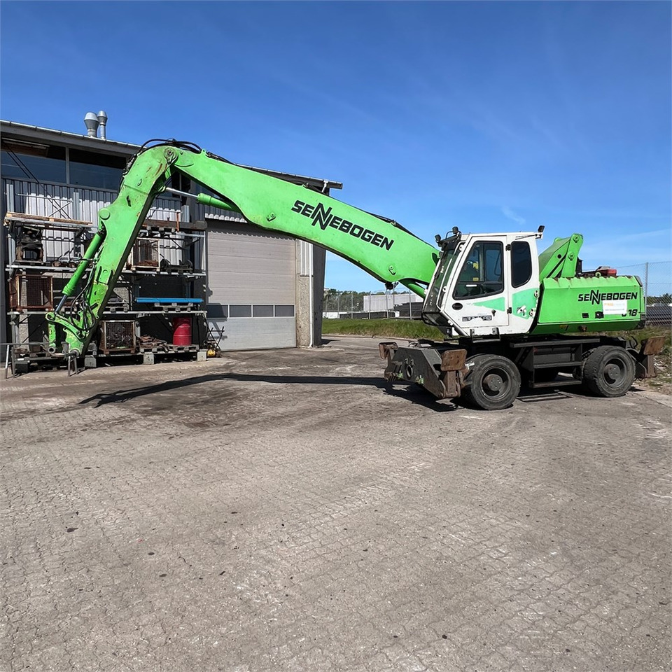Sennebogen 818 M - حفارة النقل والشحن: صور 1 Sennebogen 818 M - حفارة النقل والشحن: صور 1