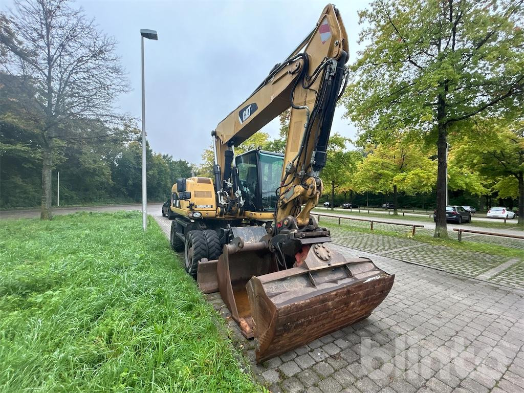 CAT M 318D - حفارة على عجلات: صور 2 CAT M 318D - حفارة على عجلات: صور 2